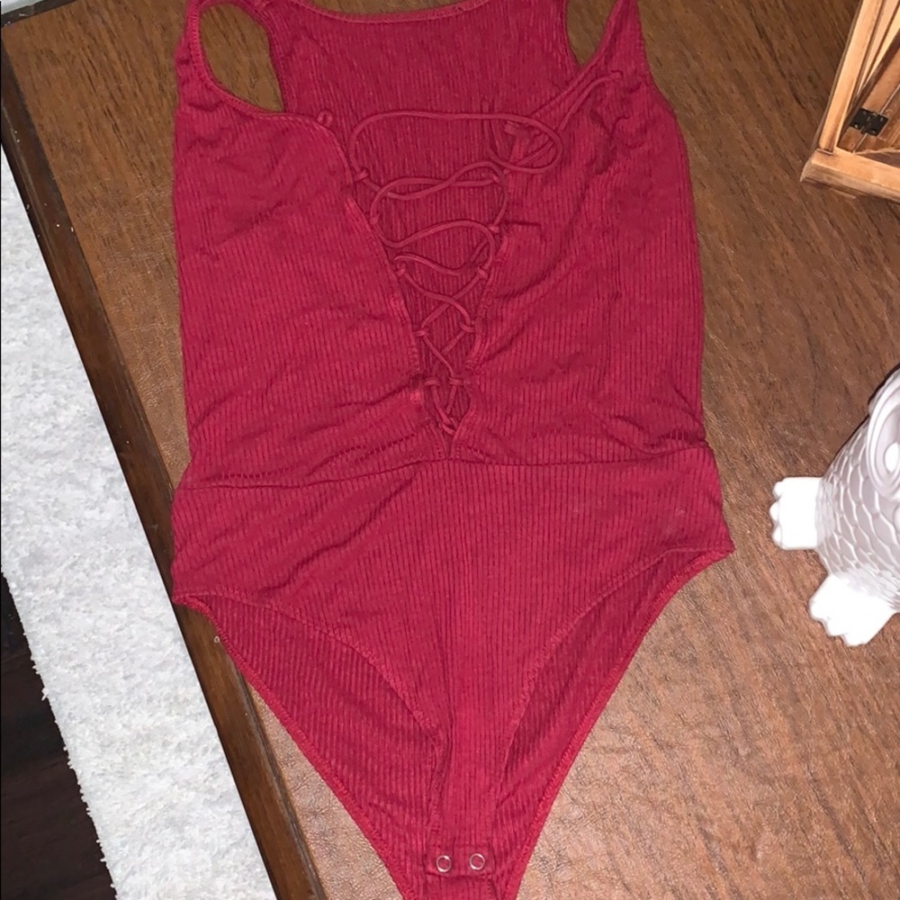 A strap up burgundy Bodysuy